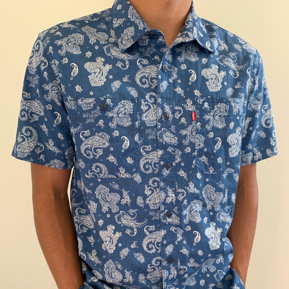 Blue shirt with white designs